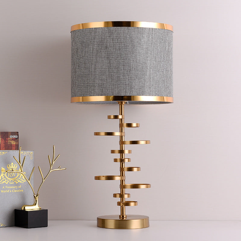 Gold Stacked Disc Table Lamp, White Drum Shade with Gold Trim