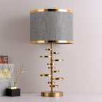 Gold Stacked Disc Table Lamp, White Drum Shade with Gold Trim