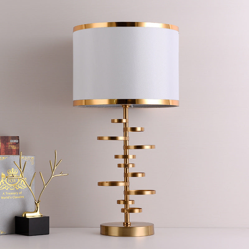Gold Stacked Disc Table Lamp, White Drum Shade with Gold Trim