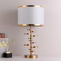 Gold Stacked Disc Table Lamp, White Drum Shade with Gold Trim