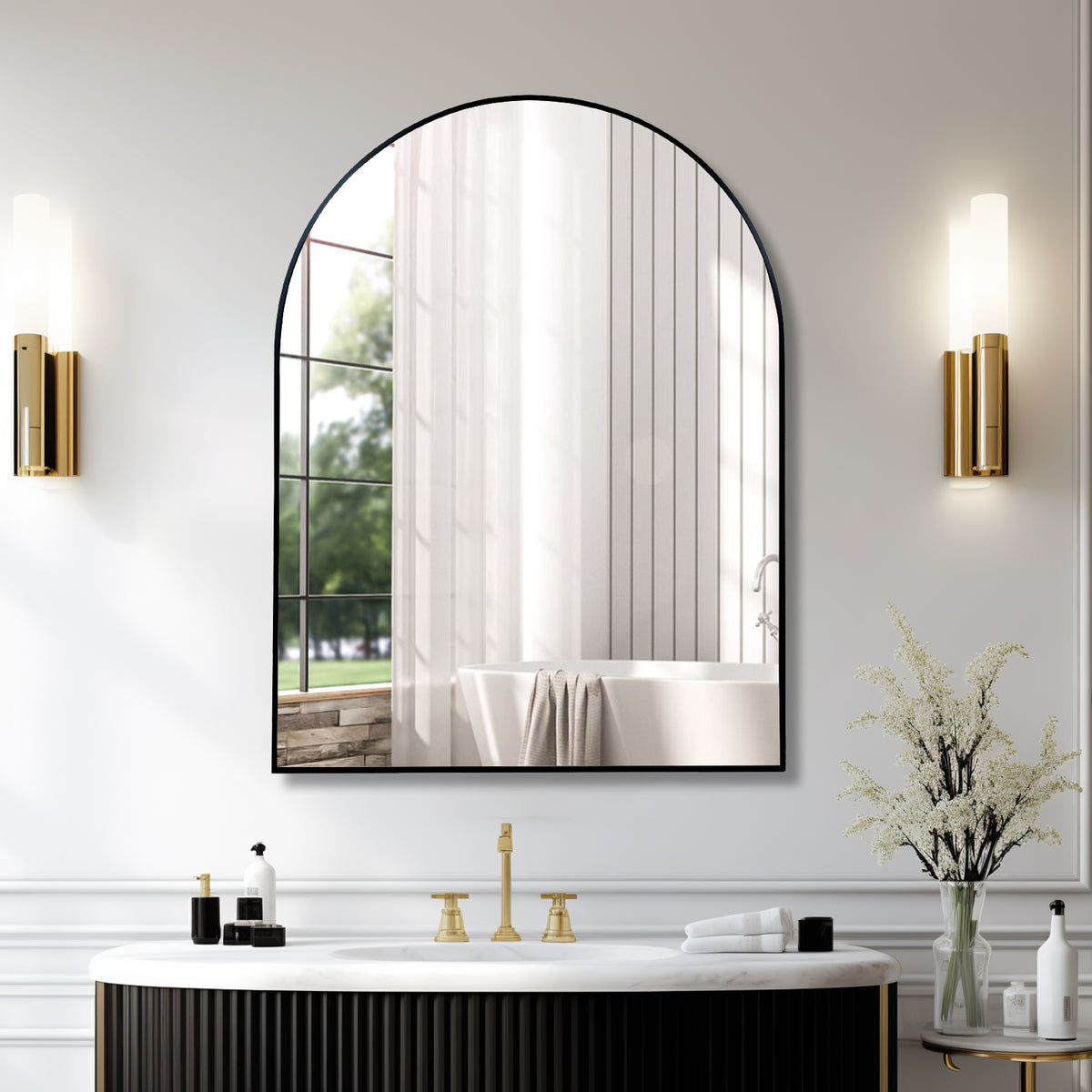 Large 30 x 40 in arched black mirror above a fluted vanity