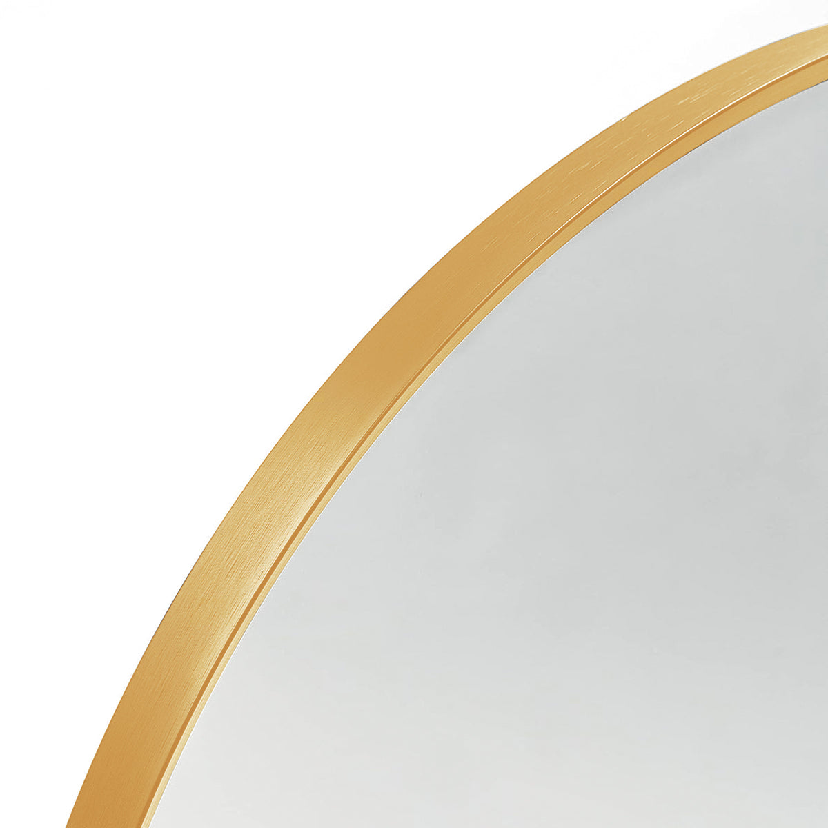 Arched wall mirror — detail of the curved brushed gold aluminum frame