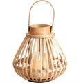 Bamboo slat lantern candle holder with bentwood handle and a flameless pillar inside, on a plain white background
