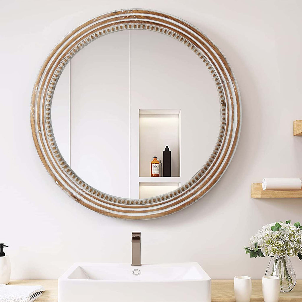 Beaded round wall mirror in natural whitewash above a white bathroom sink