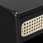 Black nightstand — detail of the woven rattan cane panel and rounded frame edge