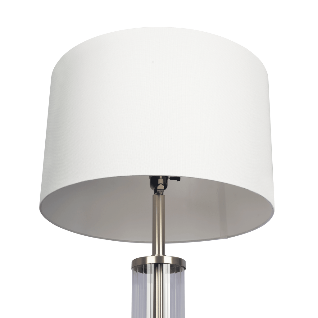 Glass column floor lamp — detail of the white drum shade, socket and brushed nickel collar