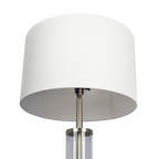 Glass column floor lamp — detail of the white drum shade, socket and brushed nickel collar
