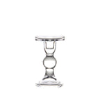 Tall clear glass pillar candle holder with a ball stem on a plain white background