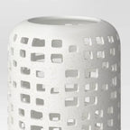 Cutout ceramic lantern — detail of the open top and rows of square cutouts