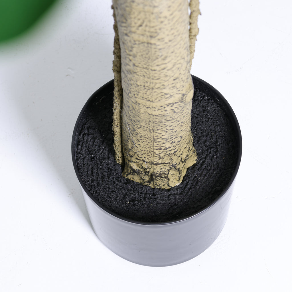 Faux fiddle leaf fig tree — detail of the bark-textured trunk in its black pot