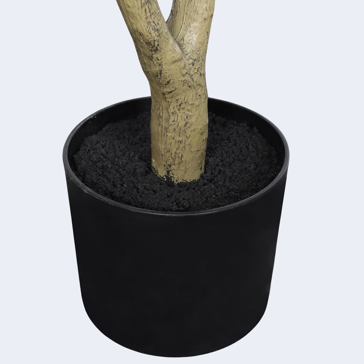 Faux olive tree — detail of the bark-textured trunk in its black plastic pot