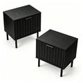 Set of two fluted black nightstands with metal legs on a plain white background