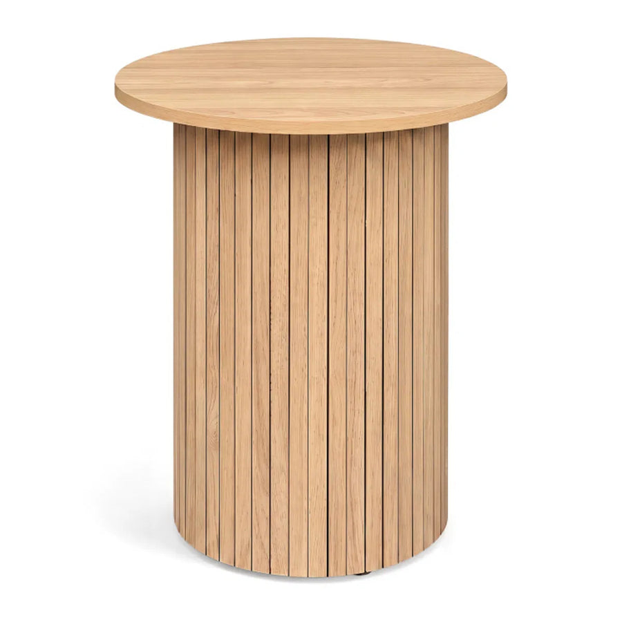 Fluted drum pedestal side table in natural wood-look finish on a plain white background