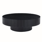 Fluted round drum coffee table in matte black on a plain white background