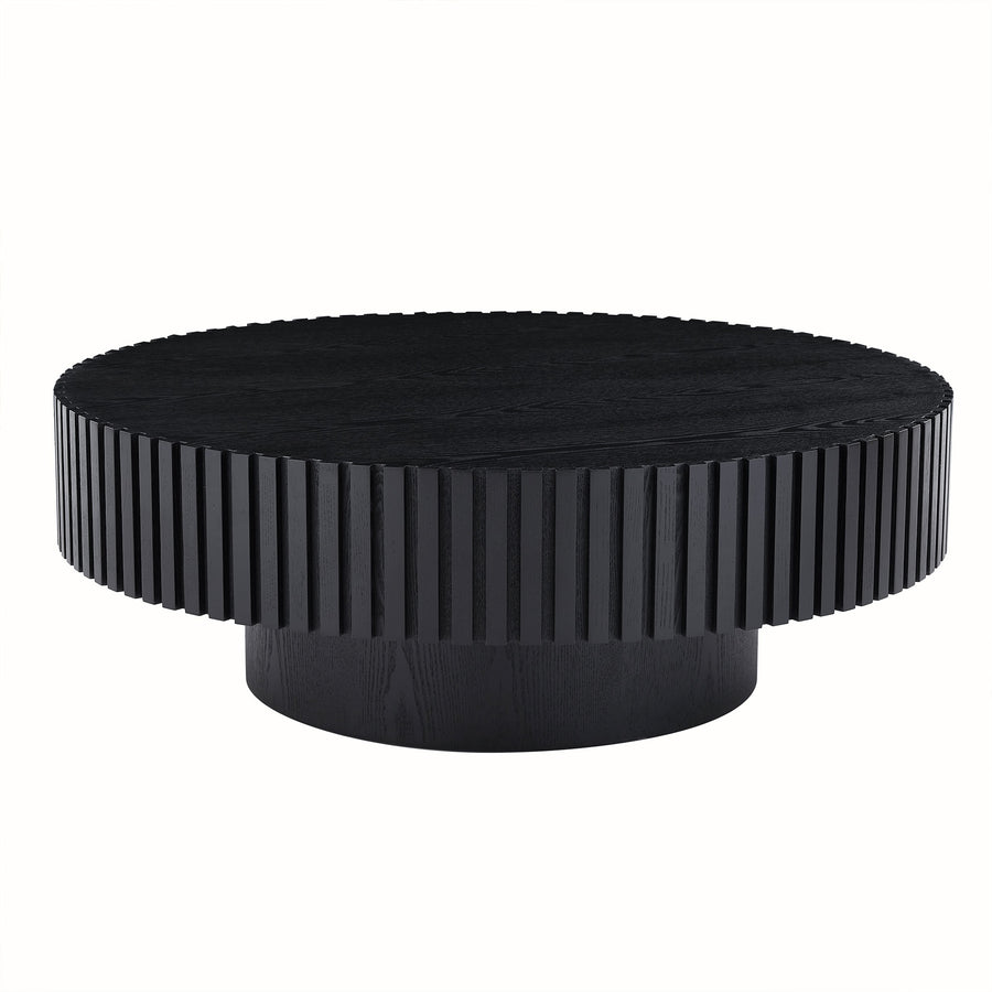 Fluted round drum coffee table in matte black on a plain white background
