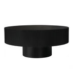 Fluted round drum coffee table in black with pedestal base on a plain white background