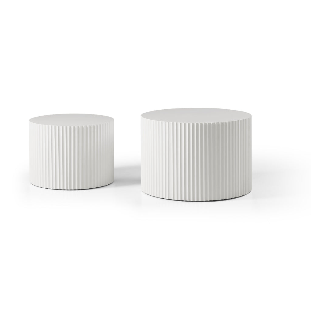White fluted drum tables side by side, small on the left and large on the right, on a white background