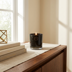 THE MODERN ALCHEMIST Premium 300g Soy Wax Scented Candle styled in a warm modern interior