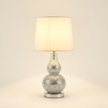 19.5 In Mirror Glass Mosaic Silver Chrome Polyresin Table Lamp on a warm cream background