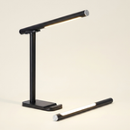 Echo Brushed Nickel Table Lamp With On Off Switch Clear Glass Body Met on a warm cream background