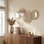 Round Metal Wall Mirror, Asymmetrical Gold Frame, 42 in for Living Room Entryway styled in a room