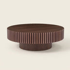 Round Pedestal Coffee Table, Walnut, 31.5 in on a warm cream background