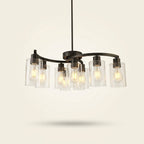 9-Light Black Iron Chandelier with Clear Glass Shades, 30 in on a warm cream background