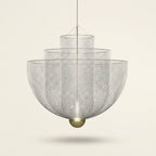 Iron Mesh Pendant Light, Sculptural Shadow-Play Shade, 18 in on a warm cream background