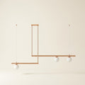 3-Light Linear Pendant Light, Copper or Black Metal & Glass on a warm cream background