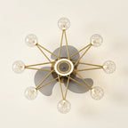 Starry Globe Ceiling Fan with LED Light, Milky White or Star Shades on a warm cream background