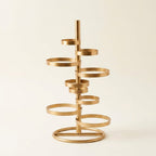Gold Stacked Disc Table Lamp, White Drum Shade with Gold Trim on a warm cream background