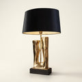 Sculptural Gold Resin Table Lamp, Black Drum Shade, 27 Inch on a warm cream background