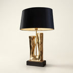 Sculptural Gold Resin Table Lamp, Black Drum Shade, 27 Inch on a warm cream background