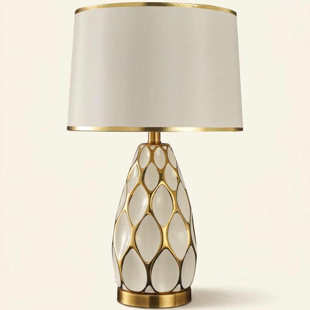 Honeycomb Ceramic Table Lamp, Cream with Gold Trim Shade on a warm cream background