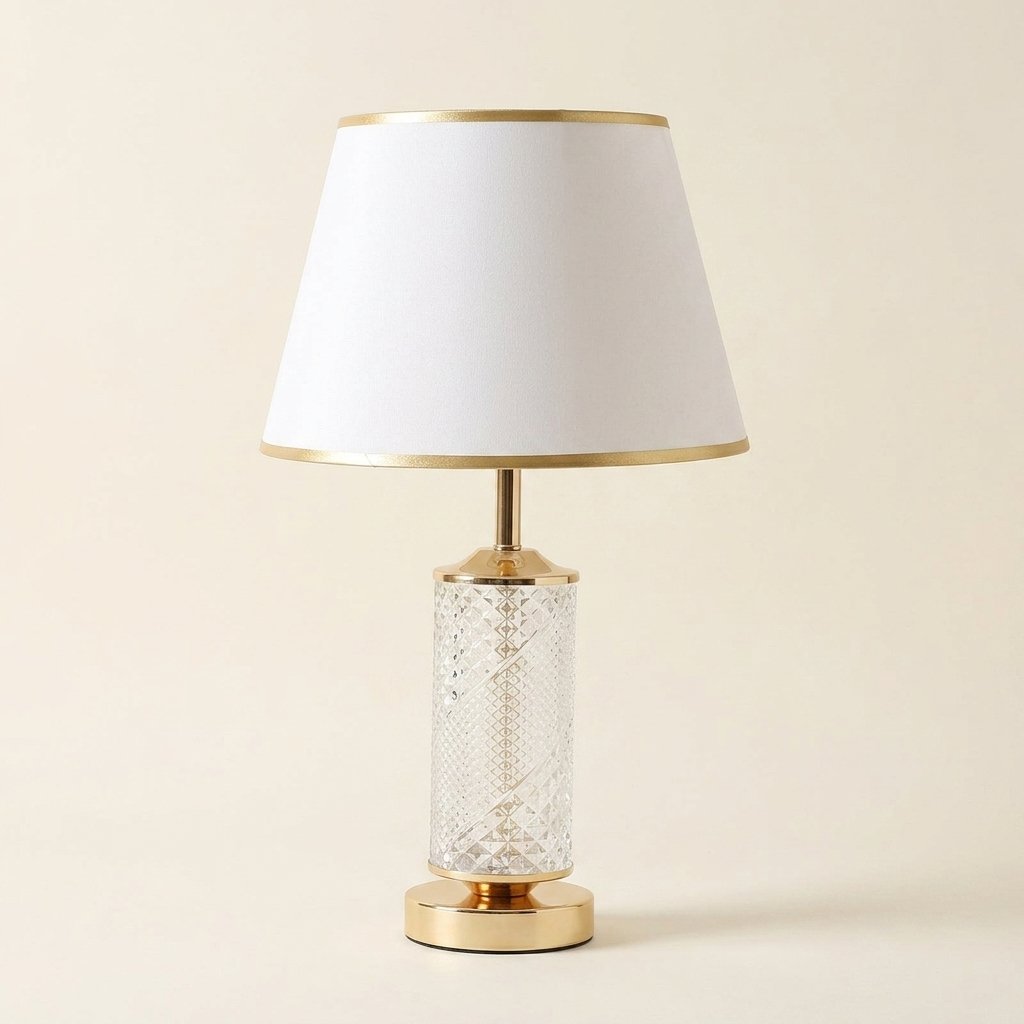 Textured Glass Table Lamp with Lit Base, Gold Trim Shade on a warm cream background