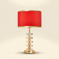 Stacked Crystal Table Lamp, Drum Shade with Gold Trim, 17 Inch on a warm cream background