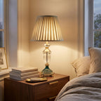 French Crystal Table Lamp, Pleated Shade, Enamel Brass Base styled in a warm modern interior