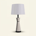 Leather-Wrapped Table Lamp, Cream with Black Piping, 25 Inch on a warm cream background