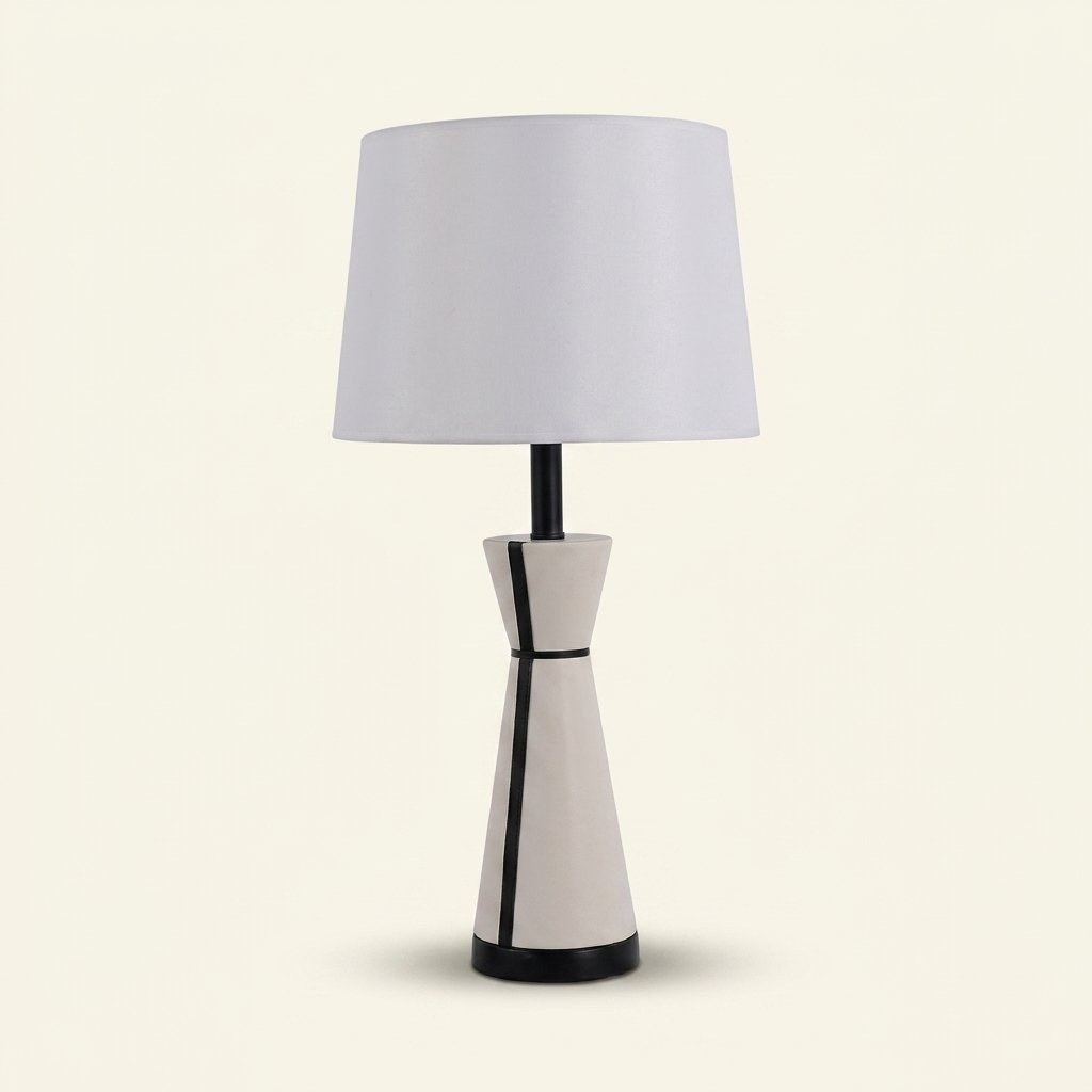 Leather-Wrapped Table Lamp, Cream with Black Piping, 25 Inch on a warm cream background
