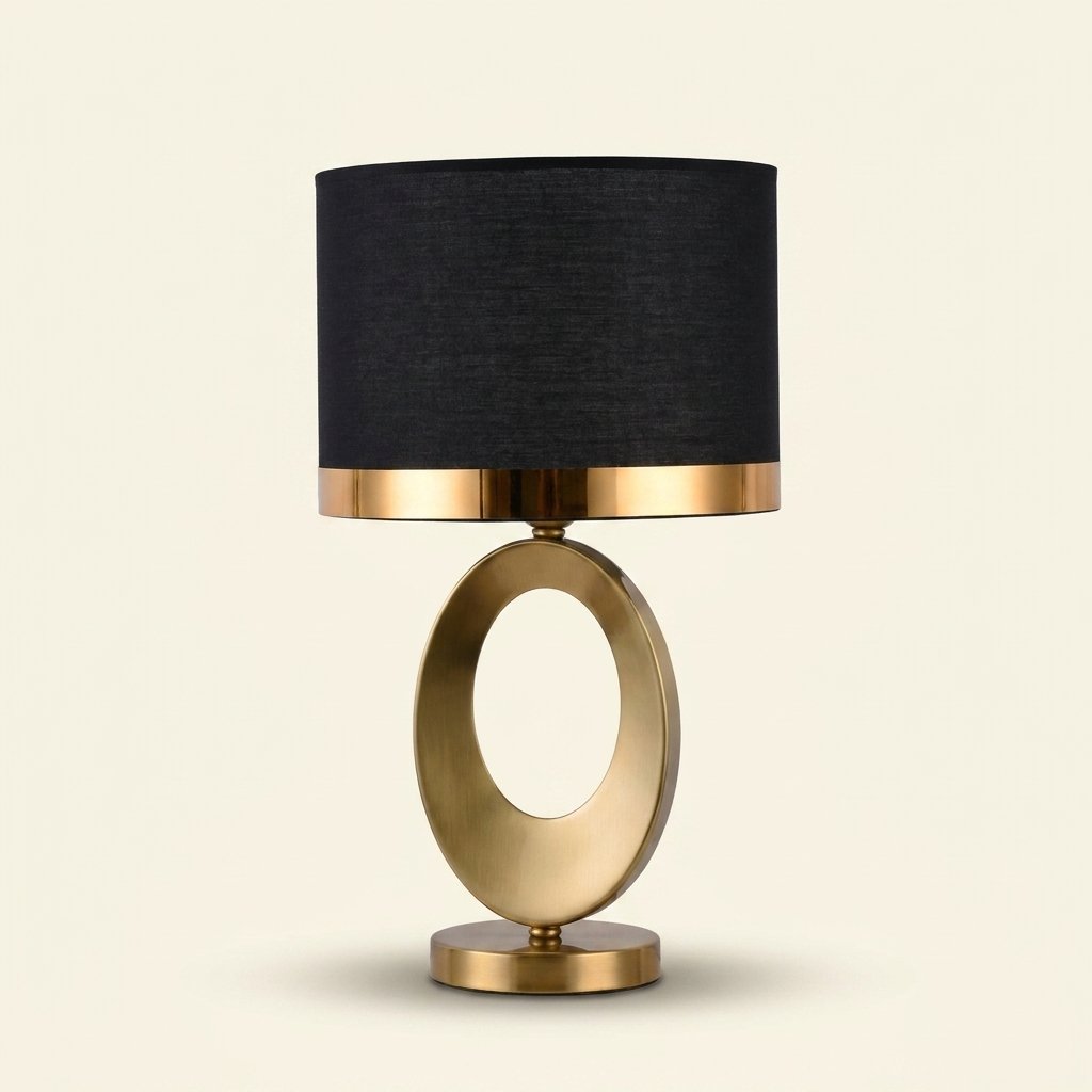 Gold Oval Ring Table Lamp, Black Linen Drum Shade, 20 Inch on a warm cream background