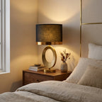 Gold Oval Ring Table Lamp, Black Linen Drum Shade, 20 Inch styled in a warm modern interior