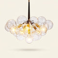 Modern 3-Light Glass Bubble Ball Pendant, 9 Clear Spheres on a warm cream background