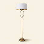 Brass Hoop Floor Lamp with White Drum Shade, 65 Inch on a warm cream background