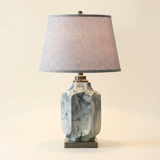 Ink Wash Ceramic Table Lamp, Copper Accents, Gray Linen Shade on a warm cream background