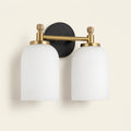 Traditional 2-Light Vanity Wall Sconce, White Frosted Glass, Black and Gold for Bathroom on a warm cream background