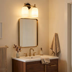 Traditional 2-Light Vanity Wall Sconce, White Frosted Glass, Black and Gold for Bathroom styled in a warm modern interior