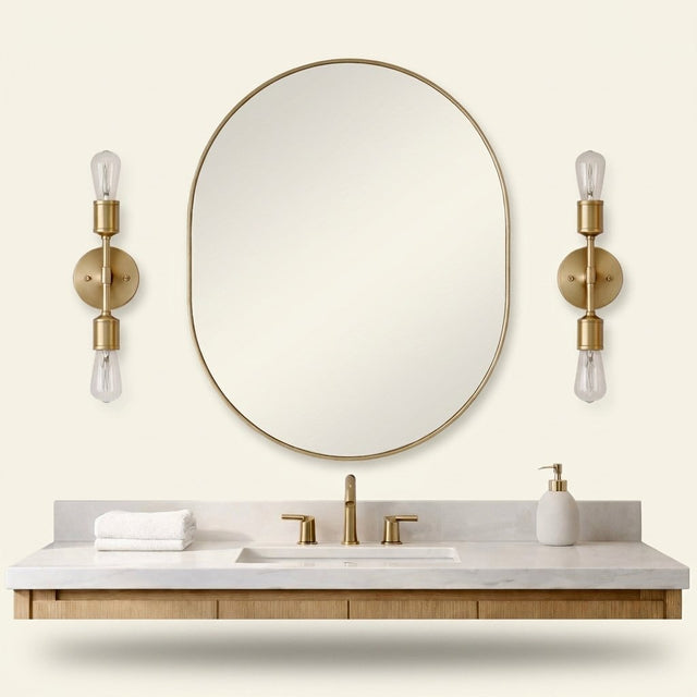 Modern 2-Light Wall Sconce with Clear Glass Shades, Gold Finish, for Bathroom Vanity Over Mirror on a warm cream background
