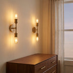 Modern 2-Light Wall Sconce with Clear Glass Shades, Gold Finish, for Bathroom Vanity Over Mirror styled in a warm modern interior