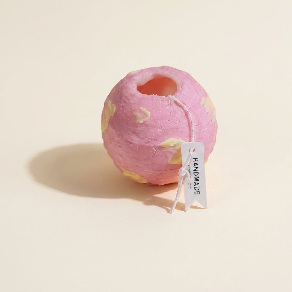 Spinning Globe Scented Candle, Hand-Poured Wax with Rotating Design, for Home Decor Accent on a warm cream background