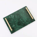 Green marble vanity tray with gold-tone bar handles on a plain white background